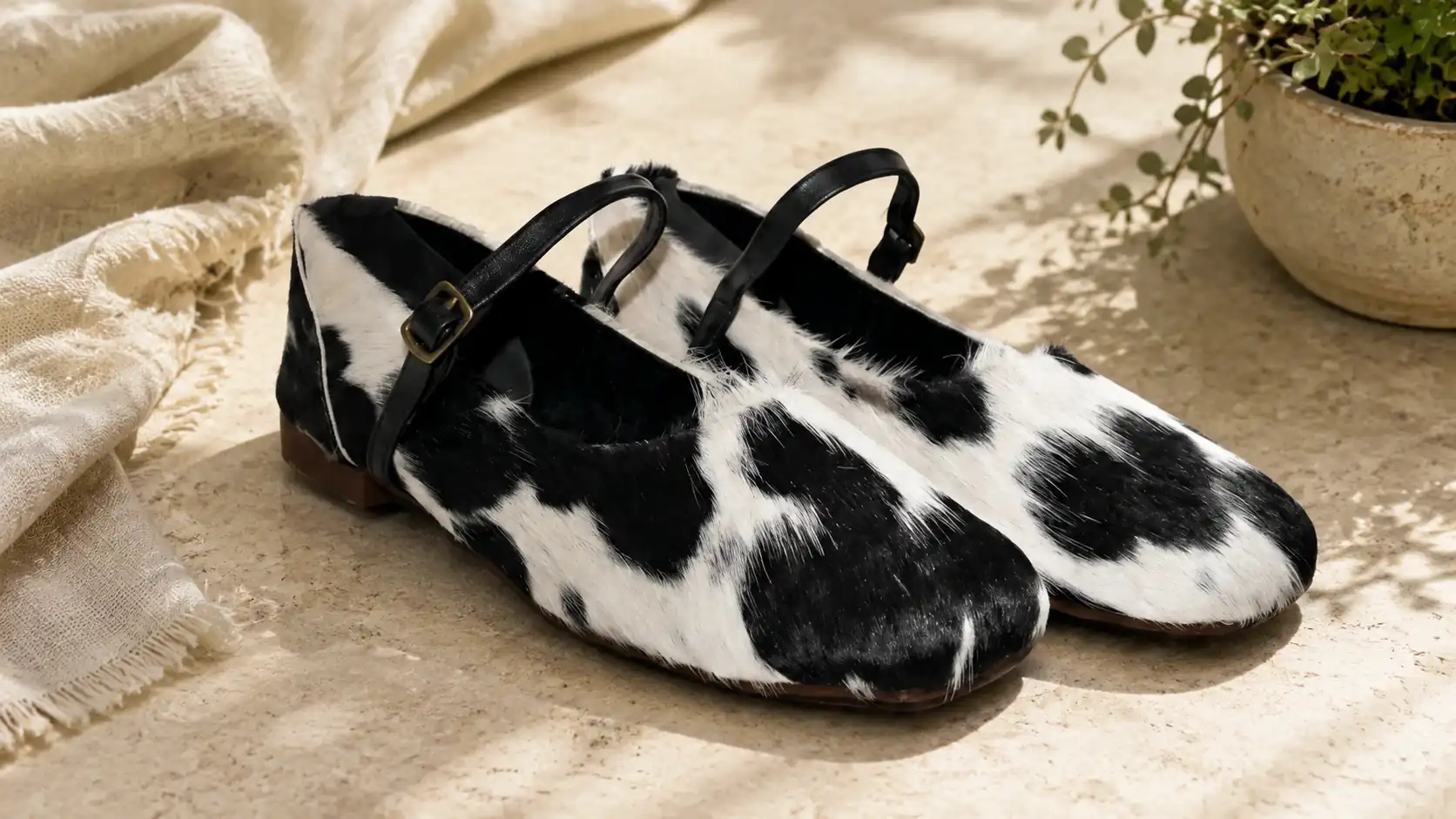 Hair on hide mule loafer pumps in brown and white cowhide leather by FATO Leather